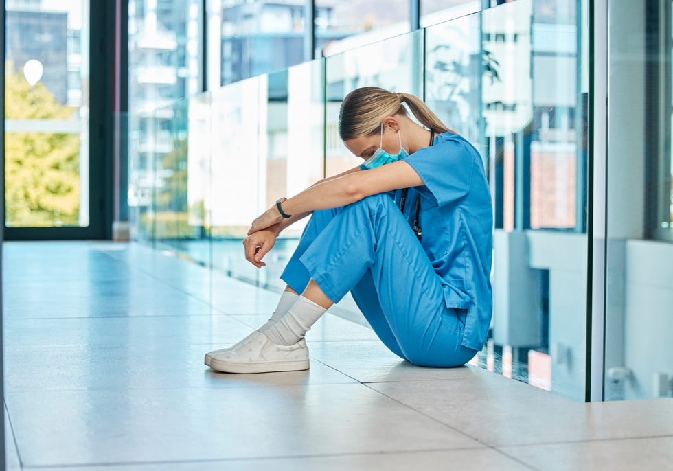 Health, doctor and woman on floor with fatigue for burnout, mistake or surgery fail in hospital. Tired, healthcare and sad female physician with face mask in clinic for stress, medical crisis or loss